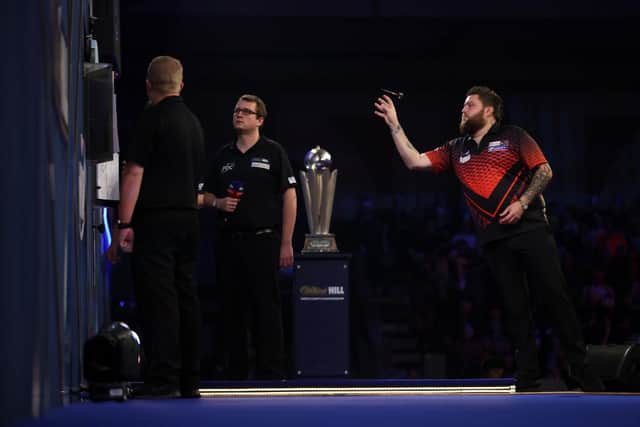 Michael Smith at the oche in the final of The William Hill World Darts Championship at Alexandra Palace. (Photo by Luke Walker/Getty Images)