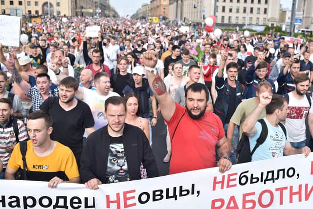 People shout slogans during a protest rally against police violence in Belarus.