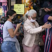 Not everyone seems to be able to stop their coronavirus mask from falling down towards their chin (Picture: Mark Lennihan/AP)