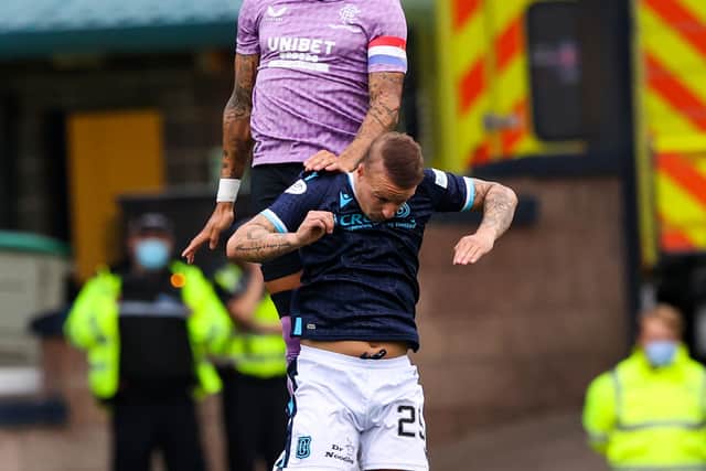 James Tavernier rises above Leigh Griffiths during Saturday's 1-0 win over Dundee.