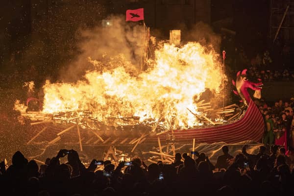 The Jarl Squad set light to the galley in Lerwick on the Shetland Isles during the Up Helly Aa fire festival. Originating in the 1880s, the festival celebrates Shetland's Norse heritage. Jane Barlow/PA Wire