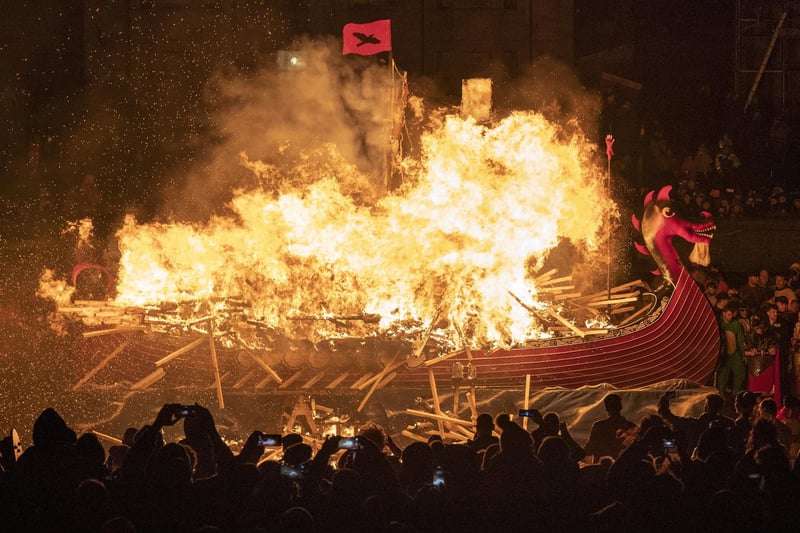 The Jarl Squad set light to the galley in Lerwick on the Shetland Isles during the Up Helly Aa fire festival. Originating in the 1880s, the festival celebrates Shetland's Norse heritage. Jane Barlow/PA Wire