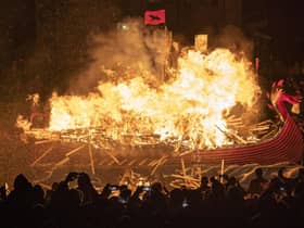 The Jarl Squad set light to the galley in Lerwick on the Shetland Isles during the Up Helly Aa fire festival. Originating in the 1880s, the festival celebrates Shetland's Norse heritage. Jane Barlow/PA Wire