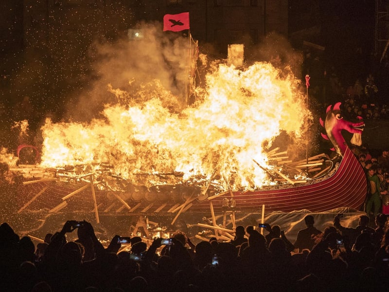 The Jarl Squad set light to the galley in Lerwick on the Shetland Isles during the Up Helly Aa fire festival. Originating in the 1880s, the festival celebrates Shetland's Norse heritage. Jane Barlow/PA Wire
