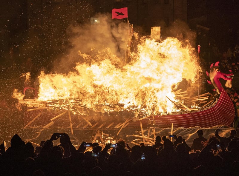 The Jarl Squad set light to the galley in Lerwick on the Shetland Isles during the Up Helly Aa fire festival. Originating in the 1880s, the festival celebrates Shetland's Norse heritage. Jane Barlow/PA Wire