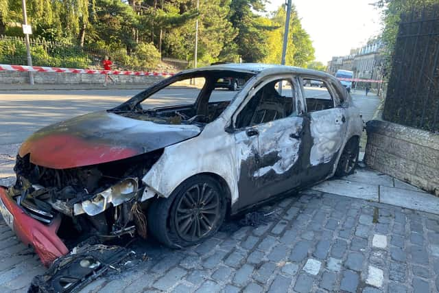 The shell of a burnt out car in Inverleith