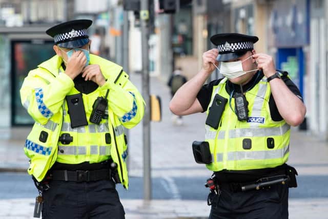 Police in Scotland will have new powers to break up house parties with more than 15 people from today, in an effort to prevent the spread of coronavirus.  (Photo by Lesley MARTIN / AFP) (Photo by LESLEY MARTIN/AFP via Getty Images)