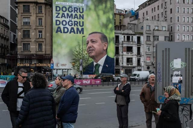 A poster shows the portrait of Turkey's President Recep Tayyip Erdogan ahead of the presidential elections this weekend.