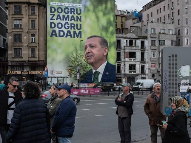 A poster shows the portrait of Turkey's President Recep Tayyip Erdogan ahead of the presidential elections this weekend.