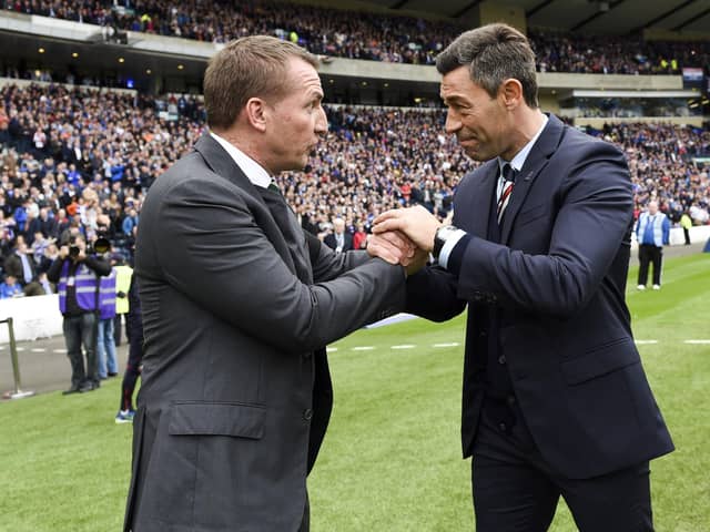 Celtic manager Brendan Rodgers (left) with Rangers manager Pedro Caixinha in 2017.