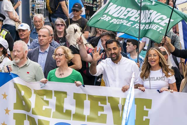 Humza Yousaf and Scottish Green co-leader Lorna Slater march side by side during a Believe in Scotland rally in September (Picture: Jane Barlow/PA)