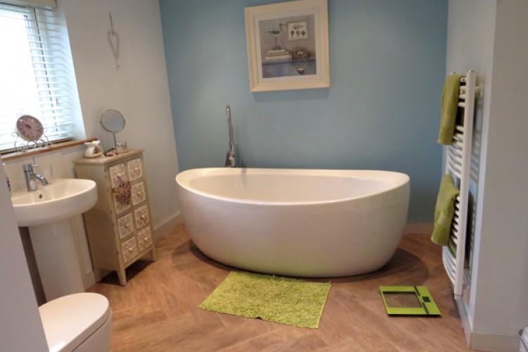 The free standing bath adds a stylish touch to the family bathroom.