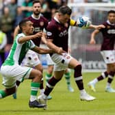 Hearts' Lawrence Shankland and Hibs' Allan Delferriere compete during the Edinburgh derby draw at Tynecastle. (Photo by Mark Scates / SNS Group)