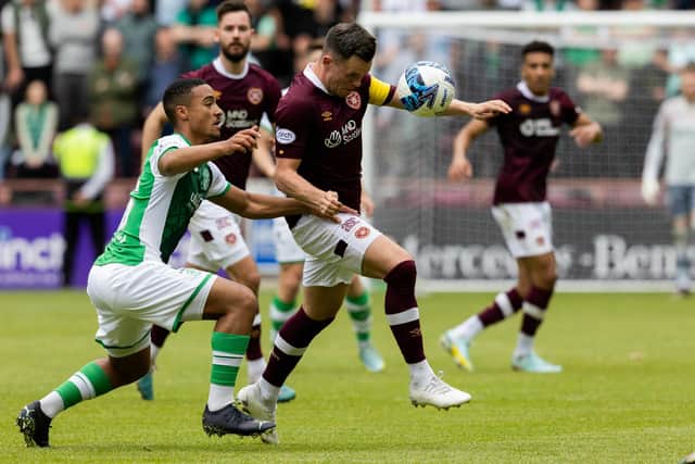 Hearts' Lawrence Shankland and Hibs' Allan Delferriere compete during the Edinburgh derby draw at Tynecastle. (Photo by Mark Scates / SNS Group)