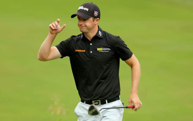 David Law acknowledges the crowds after putting out on the 18th green during the third round of the BMW PGA Championship at Wentworth. Picture: Andrew Redington/Getty Images.