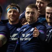 Zander Fagerson, right, celebrates Scotland’s win over England with Hamish Watson and Finn Russell. (Photo by Ross MacDonald / SNS Group)