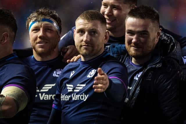 Zander Fagerson, right, celebrates Scotland’s win over England with Hamish Watson and Finn Russell. (Photo by Ross MacDonald / SNS Group)