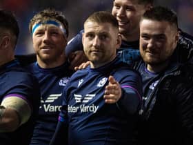 Zander Fagerson, right, celebrates Scotland’s win over England with Hamish Watson and Finn Russell. (Photo by Ross MacDonald / SNS Group)