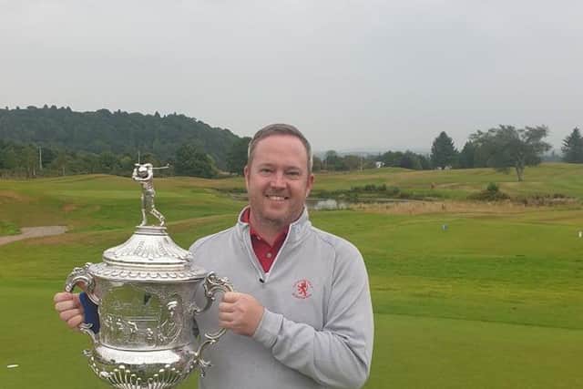 Allyn Dick celebrates after finally getting his hands on the Scottish Area Team Championship