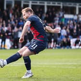 Josh Sims scores the winning penalty for Ross County in the Premiership play-off final.  (Photo by Craig Williamson / SNS Group)