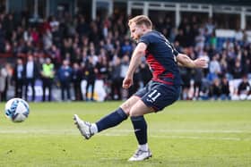 Josh Sims scores the winning penalty for Ross County in the Premiership play-off final.  (Photo by Craig Williamson / SNS Group)
