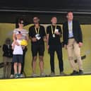 Race director Christian Prudhomme joined on stage by Moore's wife Virginie and five-year-old son Maxime, plus his colleagues Daniel Friebe and Lionel Birnie. Pic: Charlotte Elton
