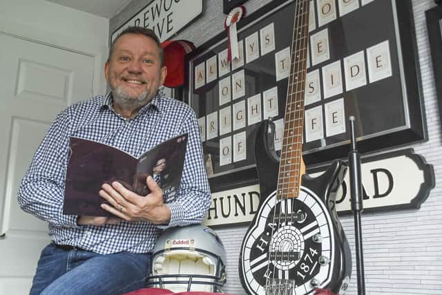 Scott Wilson, just retired as the Voice of Hearts, in his man-cave celebrating his twin loves of pop music and the football team down Gorgie way. Pic: Lisa Ferguson