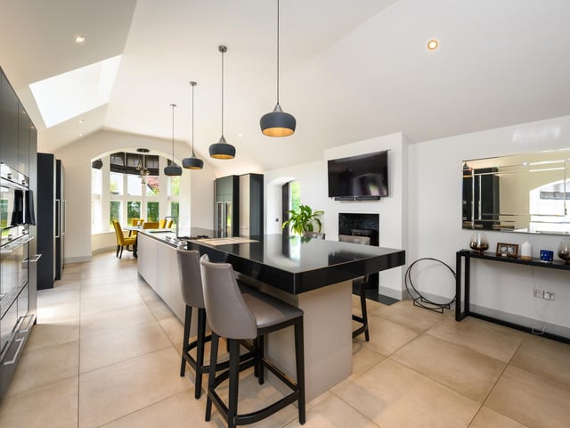 Its formal lounge is similar in size, while to the rear of the property lies an impressive new billiards room with bar area, and French doors opening to the back garden, as well as a gym with full-height glazing.
On the first floor are three ensuite bedrooms, the largest of which has a walk-in dressing room, with the fourth on the top storey.