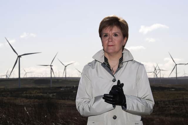 Scotland's First Minister and leader of the Scottish National Party (SNP), Nicola Sturgeon poses for a photograph on a campaign visit to Whitelee Wind Farm near Eaglesham