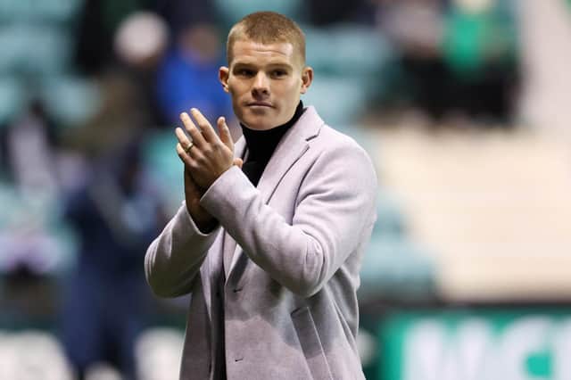New Hibs signing Chris Mueller applauds the fans.