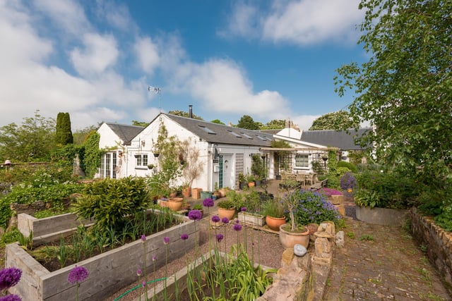 The cottage, which sits in around an acre of gardens and grounds, has been tastefully modernised
