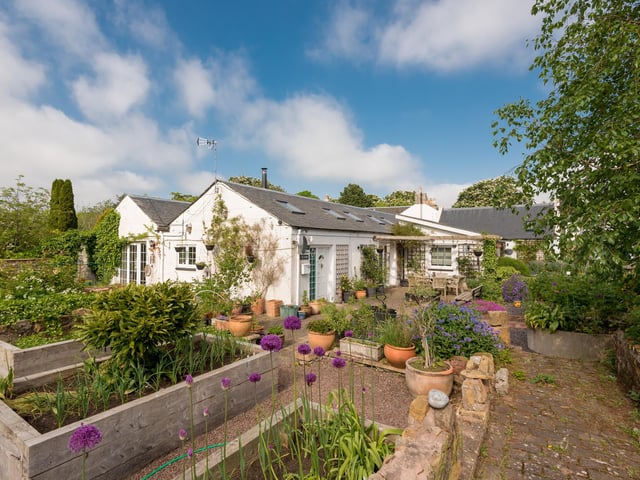 The cottage, which sits in around an acre of gardens and grounds, has been tastefully modernised