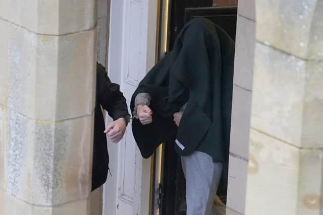 Andrew Miller (covered) being led from Selkirk Sheriff Court following an earlier hearing. Picture: Andrew Milligan/PA Wire
