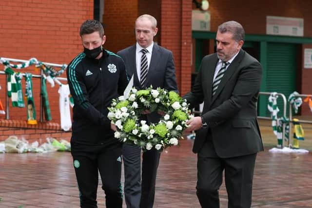 Celtic captain Callum McGregor, chief executive Michael Nicholson and manager Ange Postecoglou lay a wreath at Celtic Park on November 16, 2021 for legendary former player Bertie Auld who has died aged 83.  (Photo by Alan Harvey / SNS Group)