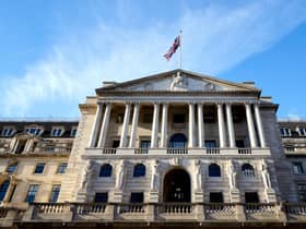The Bank of England, above, has a target to peg inflation at about 2 per cent.