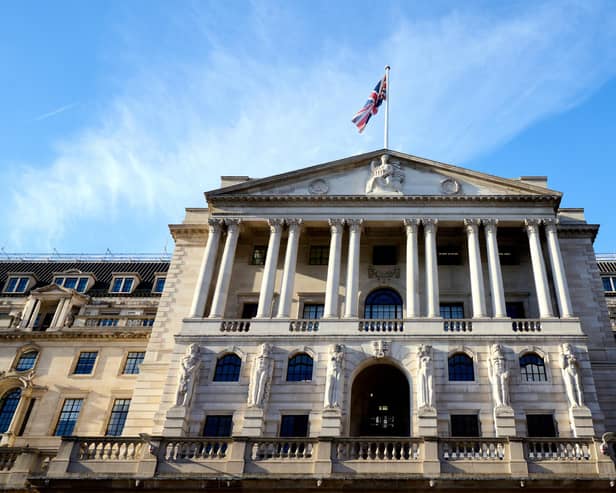 The Bank of England, above, has a target to peg inflation at about 2 per cent.