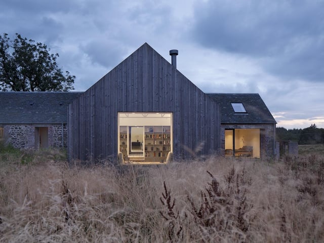 This new house is located within and around a ruined building in the Ayrshire landscape – formed over two hundred years to house people and cattle. Ann Nisbet Studio conceived the project as a ‘building within a ruin’ – taking a quiet, honest and restrained approach that brings the building gently back to life as a home while retaining the character of the ruin. In the wrong hands, the ruin could have been over-domesticated or romanticised: instead it retains its character and relationship to the landscape, thanks to a light-touch and respectful approach, as well as a careful use of materials. A simple timber-clad second building, connected to the ruin by a glazed link, provides additional space.