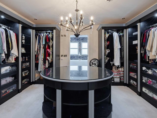 The principal bedroom suite features a walk-in dressing area.
Contact: Turpie & Co.