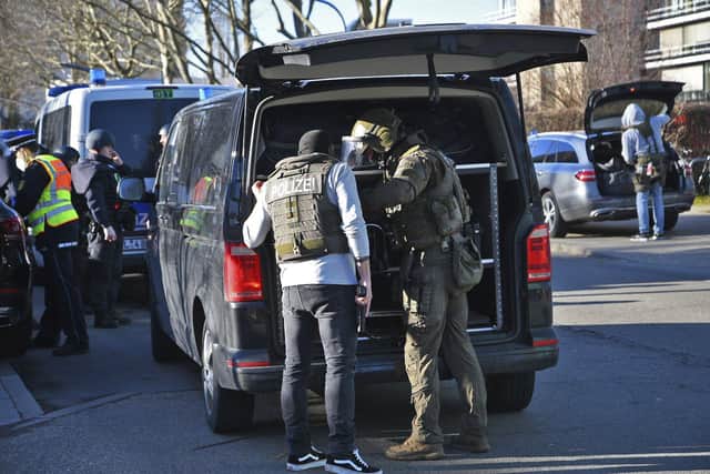 Members of the SEK stand by a vehicle on the campus of Heidelberg University in Heidelberg, Germany, Monday, Jan. 24, 2022. German police say a lone gunman wounded several people at a lecture theatre in the southwest city of Heidelberg on Monday (Photo: R.Priebe/Pr-Video/dpa via AP).