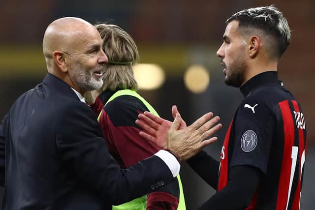 AC Milan coach Stefano Pioli shakes hands with another of Milan's star men, Theo Hernandez (Photo by Marco Luzzani/Getty Images)