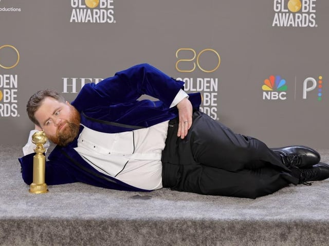 Paul Walter Hauser poses with the Best Performance in a Limited or Anthology Series or Television Film award which he won for his role in Black Bird.