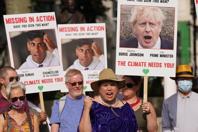 Protesters at a rally organised by the Climate Coalition call on Boris Johnson and Chancellor Rishi Sunak to do more to tackle climate change (Picture: Stefan Rousseau/PA Wire)