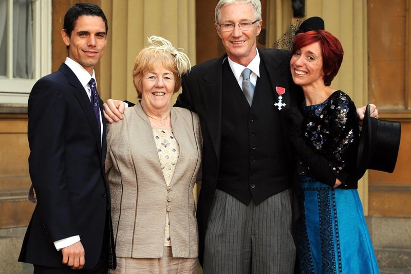 Paul O'Grady with his partner, Andre Portasio (left), sister Sheila Rudd and daughter Sharyn Mousley at Buckingham Palace, where he was made a Member of the Order of the British Empire.