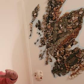 Harry Young with his rock map of Scotland (Picture: Harry Young via SWNS)