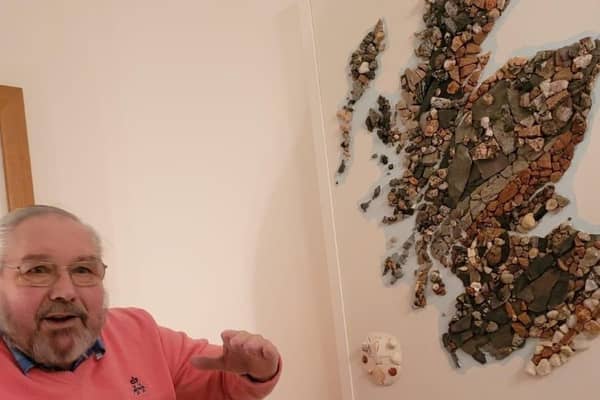 Harry Young with his rock map of Scotland (Picture: Harry Young via SWNS)