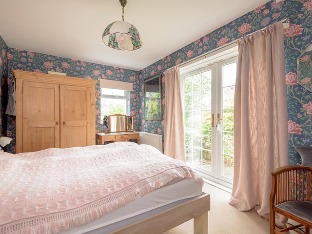 Three of the four bedrooms have French doors, giving direct access to the garden