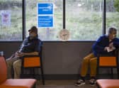 Patients sit in the observation area after receiving a Covid-19 vaccine from their GP. Picture: PA.