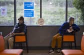 Patients sit in the observation area after receiving a Covid-19 vaccine from their GP. Picture: PA.