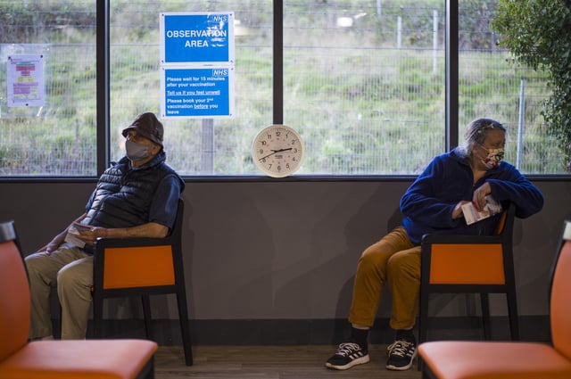 Patients sit in the observation area after receiving a Covid-19 vaccine from their GP. Picture: PA.