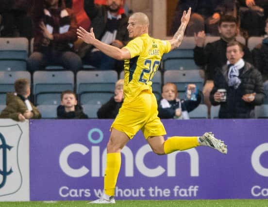 Ross County's Harry Clarke celebrates scoring against Dundee at Dens Park in October (Photo by Mark Scates / SNS Group)